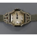 A lady's French Art Deco platinum, diamond and black onyx set cocktail watch, on a white metal