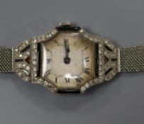 A lady's French Art Deco platinum, diamond and black onyx set cocktail watch, on a white metal