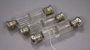 A late Victorian silver mounted glass double ended scent bottle and two other double ended scent