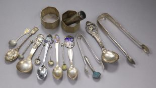 A pair of silver napkin rings, a cased cigar holder and a small group of silver and plated