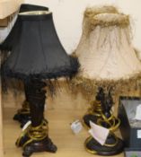 A pair of small table lamps with black shades and a pair of bronzed metal table lamps, with beige