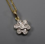 A modern 18ct gold and seven stone diamond cluster drop pendant, on an 18ct gold fine link chain,