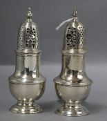 Two similar George II silver pepperettes/casters, Samuel Wood, London, 1742 & 1743, (af), tallest