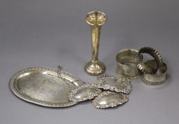 Three silver wine/spirit labels, 3 silver serviette rings, a silver specimen vase and a Thai