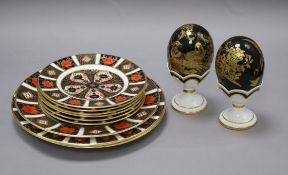 A collection of Derby plates and stands