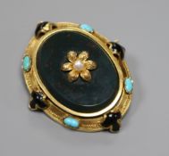 A late Victorian yellow metal, turquoise, black enamel and bloodstone set oval brooch, with