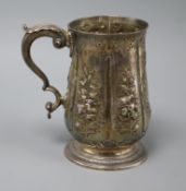 A George III later embossed silver mug, London, 1781, 13.8cm, 10.5 oz.