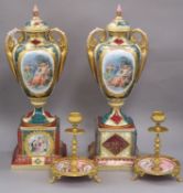 A pair of Austrian style lidded urns and a pair of gilt and ceramic candlesticks urns height 41cm