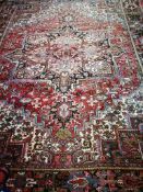 A Heriz red carpet