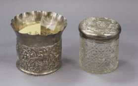 A late Victorian repousse silver cache pot by William Comyns, London, 1891 and silver mounted toilet