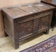 A carved oak coffer W.101cm