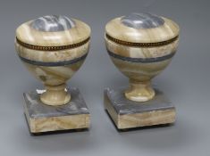A pair grey and beige marble lipped urn shaped bookends height 18cm