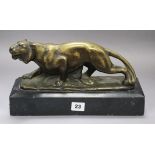 A bronze tiger on a marble base