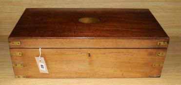 A brass-bound mahogany writing slope, c.1840, having fitted interior and side drawer to base