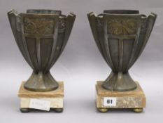 A pair of Art Deco French urns on stands bookends height 24.5cm