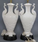 A pair of white glazed "peacock" table lamps height 50cm (one a.f.)