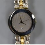 A gentlemen's Rado 'Florence' wristwatch with oval grey dial. dot markers and date aperture, on