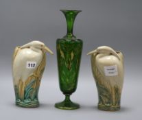 A Bohemian green and gilt glass vase, and a pair of ceramic wall pockets in the form of herons