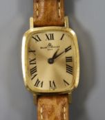 A lady's 18ct gold Baume & Mercier manual back wind wrist watch.