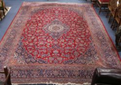 A red and blue ground rug 310 x 455cm