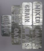 Seven tin grain stencil signs