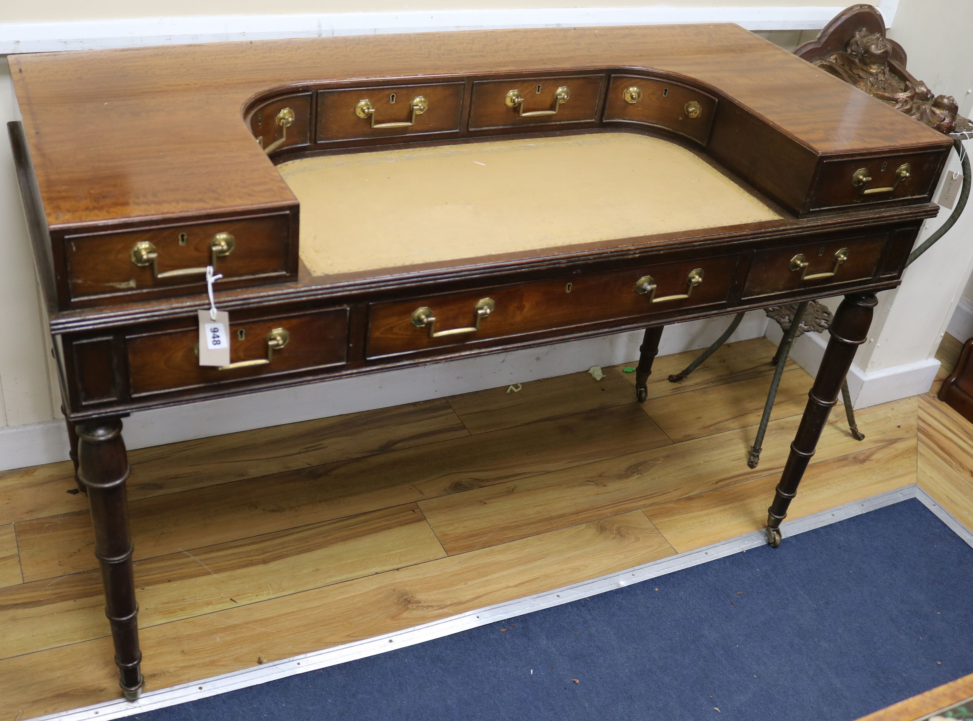 A George III style mahogany Carlton House design desk W.136cm