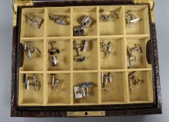 A Daines & Hathaway brown crocodile hide cufflink case containing 24 pairs of cufflinks, tie clips