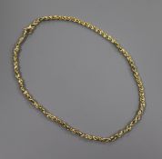 An 18ct yellow gold decorative close-link necklace with trigger clasp, 25 grams.