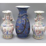 A 19th century Chinese blue ground dragon vase and a pair of famille rose vases tallest 36cm