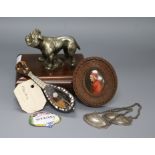 A dog paperweight, a miniature mandolin, three spirit labels, miniatures and ceramic plaque