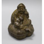 A brass seated Japanese figure of Daikoku holding mallet height 15.5cm