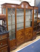 An Edwardian satinwood concave-fronted display cabinet W.166cm