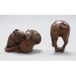 A 19th century Japanese wood netsuke of two rats with Daikoku's mallet and a wood netsuke of a