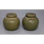 A pair of Chinese teadust glazed small jars and covers, early 20th century, 8cm high