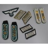 A pair of original shoulder straps, collar patches and breast eagle, a pair of shoulder straps and