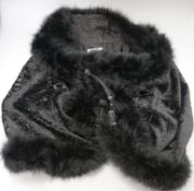A 1930's black velvet feather trimmed jacket/cape