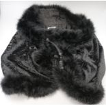 A 1930's black velvet feather trimmed jacket/cape