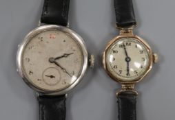 A lady's 1930's 9ct gold Rolex manual wind wrist watch and a gentleman's silver wrist watch.