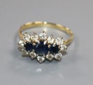 An 18ct gold, sapphire and diamond fifteen-stone cluster ring, claw set, size Q.