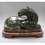 A large Chinese spinach green jade horse, on stand overall height 29.5cm
