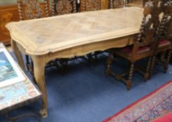 A 19th century French parquetry top dining table, on cabriole legs W.216cm