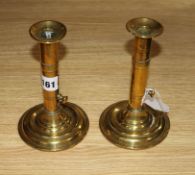 A pair of brass candlesticks