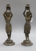 A pair of Egyptian spelter candlesticks height 38.5cm