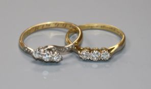 Two 18ct gold and diamond set dress rings.