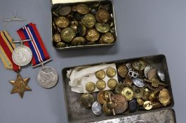 A group of three World War medals and Military buttons