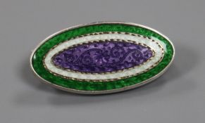 An early 20th century sterling silver mounted three colour enamel oval "Suffragette" brooch, 30mm.