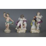 A pair of German, Meissen style Amorini with one other figure tallest 14.5cm