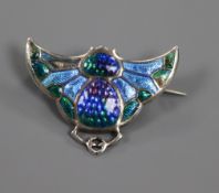 An Edwardian Art Nouveau silver and polychrome enamel "Bat" brooch, by Charles Horner, Chester,