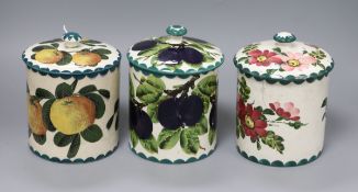 Three Wemyss biscuit barrels in Victoria Plum, Seville orange and apple blossom patterns height