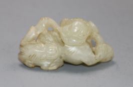 A 19th century Chinese pale celadon jade lion-dog and cub carving